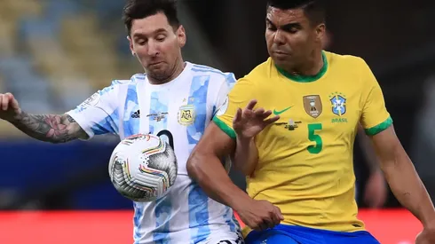 Argentina's Lionel Messi and Brazil's Casemiro fight for the ball (Getty).