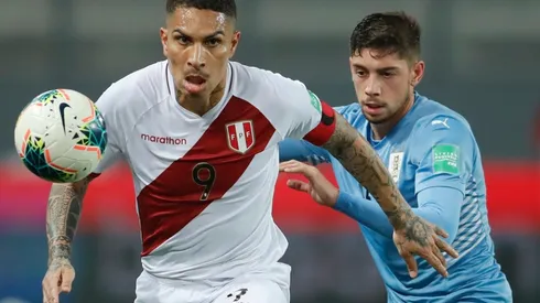 Peru's Paolo Guerrero and Uruguay's Federico Valverde fight for the ball (Getty).