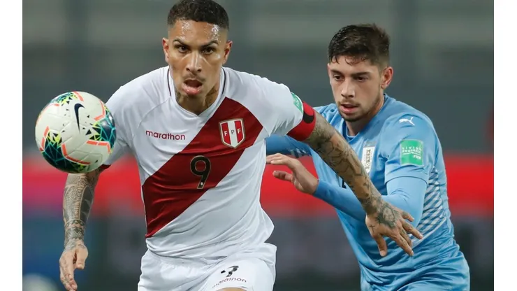 Peru's Paolo Guerrero and Uruguay's Federico Valverde fight for the ball (Getty).