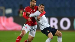 Daniel Dimov of Bulgaria (left) fights for ball control against Andrea Belotti of Italy (right) (Getty)