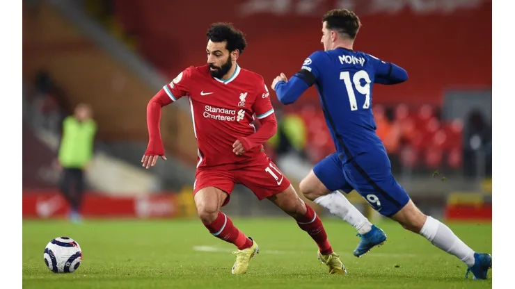 Mohamed Salah of Liverpool (left) is challenged by Mason Mount of Chelsea during the Premier League match (Getty).