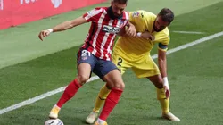 Yannick Carrasco of Atletico Madrid (left) holds the ball while Mario Gaspar of Villarreal (right) tries to block him (Getty)