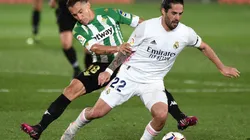 Andres Guardado of Real Betis (right behind) fights for ball control against Isco of Real Madrid (front left). (Getty)