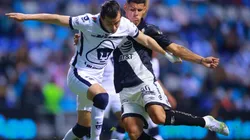 Alan Mozo of Pumas UNAM (left) runs away from Puebla defender Maximiliano Araujo (right). (Getty)