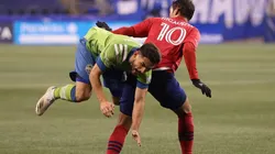 Cristian Roldan of Seattle Sounders (left) gets a fault from Andres Ricaurte of FC Dallas (right) (Getty)