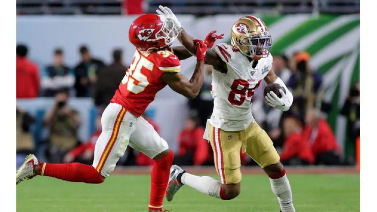 Kansas City Chief defense tries to stop San Francisco 49ers wide receiver. (Getty).