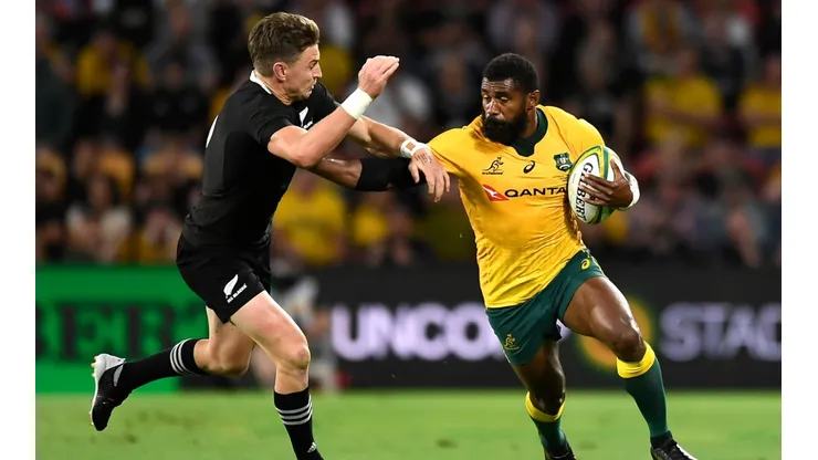 Beauden Barrett of New Zealand (left) and Marika Koroibete of Australia in action during a Rugby Championship fixture in 2020. (Getty)