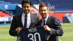 ionel Messi poses with his jersey next to PSG's President Nasser Al Khelaifi (Getty).