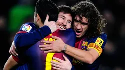 Lionel Messi (center), Xavi (left), and Carles Puyol (right) of Barcelona in 2013. (Getty)