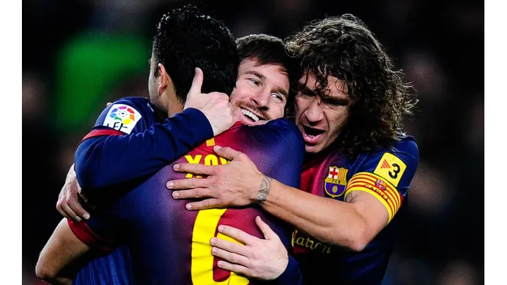 Lionel Messi (center), Xavi (left), and Carles Puyol (right) of Barcelona in 2013. (Getty)