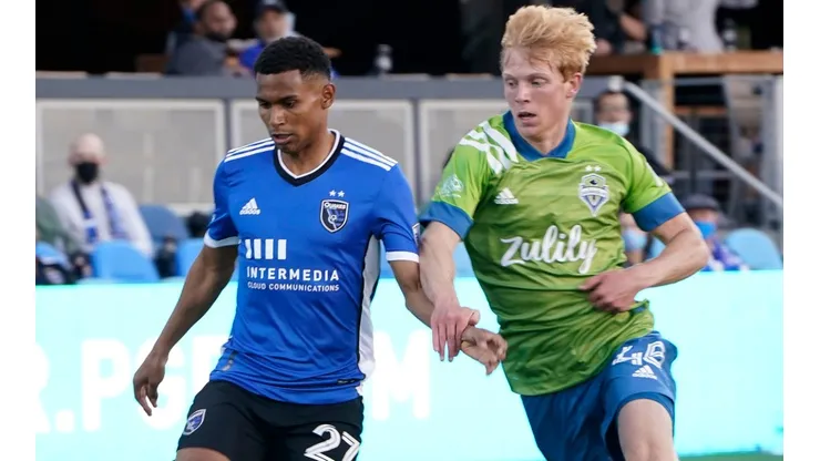 Marcos Lopez (left) of San Jose Earthquakes grabs control of the ball defended by Ethan Dobbelaere (right) of Seattle Sounders. (Getty)
