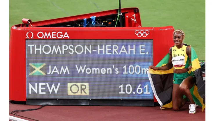 Elaine Thompson-Herah of Team Jamaica poses for a photo after winning the gold medal and setting a new Olympic record in the Women's 100m Final on day eight of the Tokyo 2020 Olympic Games at Olympic Stadium on July 31, 2021 in Tokyo, Japan.