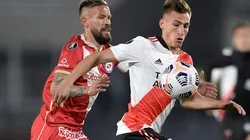 Miguel Torrén of Argentinos Juniors competes for the ball with Braian Romero of River Plate (Getty).