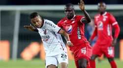 Vitinho of Athletico Paranaense (left) and Luis Paz of America de Cali (Getty).