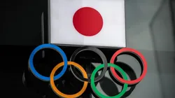 The Japanese flag is displayed over the Olympic Rings. (Getty)
