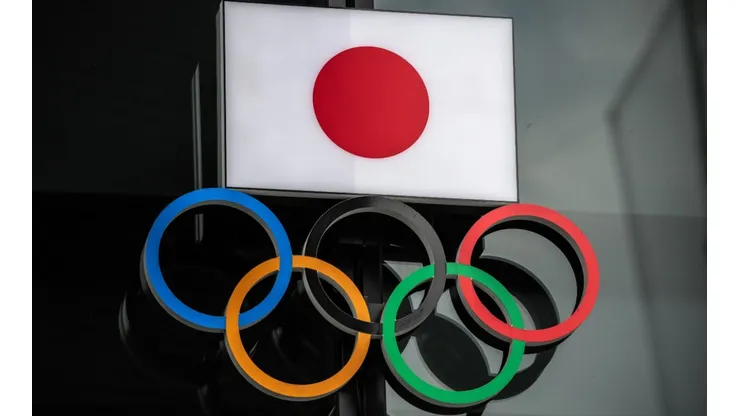 The Japanese flag is displayed over the Olympic Rings. (Getty)