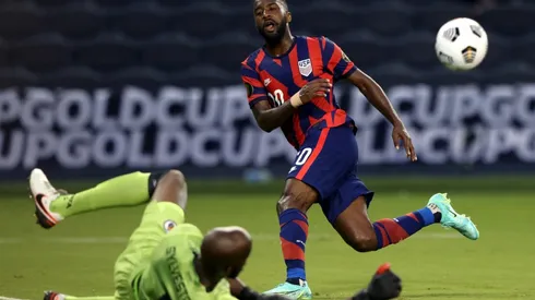 Shaq Moore of the United States try to pass Bryan Silvestre of Haiti (Getty).