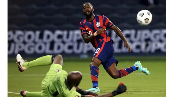 Shaq Moore of the United States try to pass Bryan Silvestre of Haiti (Getty).
