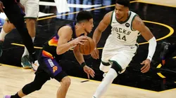 Giannis Antetokounmpo guarding Devin Booker. (Getty)