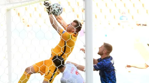 Martin Dubravka of Slovakia (left) scores an own goal. (Getty)