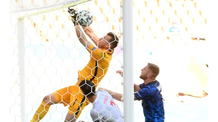 Martin Dubravka of Slovakia (left) scores an own goal. (Getty)