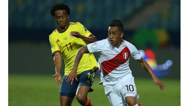 Yerry Mina of Colombia (left) and Christian Cuevas of Peru (Getty).