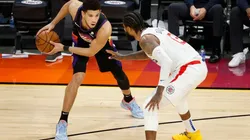 Paul George guarding Devin Booker. (Getty)