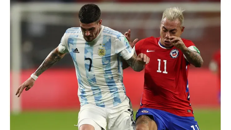 Rodrigo De Paul of Argentina (left) and Eduardo Vargas of Chile (Getty).