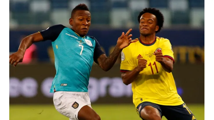 Pervis Estupiñán of Ecuador (left) and Juan Cuadrado of Colombia (Getty).
