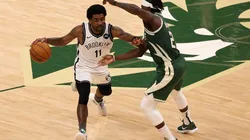Kyrie Irving vs. Jrue Holiday. (Getty)