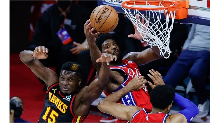 Joel Embiid scores over Clint Capela. (Getty)