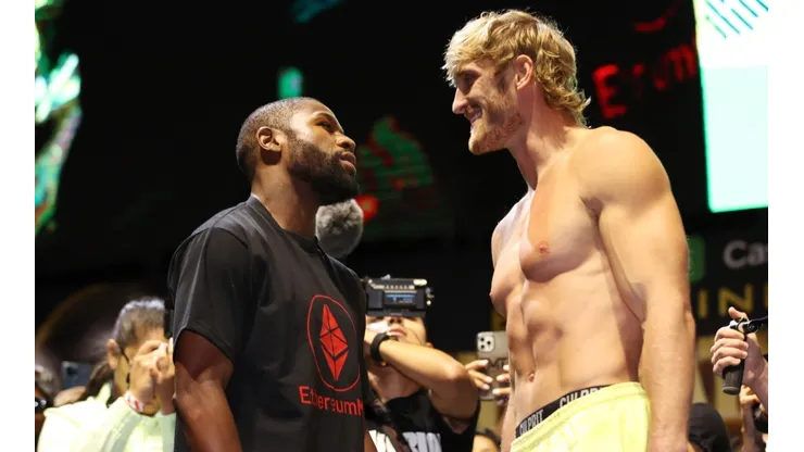 Floyd Mayweather (left) and Logan Paul (right) face off during their weigh-in. (Getty)