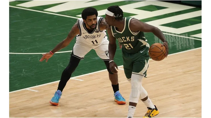 Jrue Holiday & Kyrie Irving. (Getty)