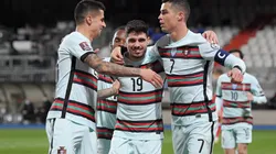 Cristiano Ronaldo (right) of Portugal celebrates with Joao Cancelo (left) and Pedro Neto (center). (Getty)