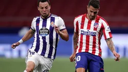 Vitolo of Atletico Madrid (riight) battles for possession with Oscar Plano of Real Valladolid (left). (Getty)