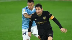 Lionel Messi of Barcelona (right) is challenged by Jeison Murillo of Celta (left). (Getty).jpg