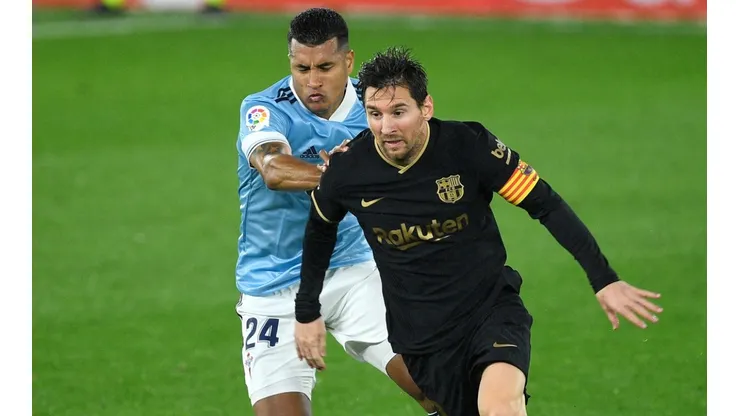 Lionel Messi of Barcelona (right) is challenged by Jeison Murillo of Celta (left). (Getty).jpg