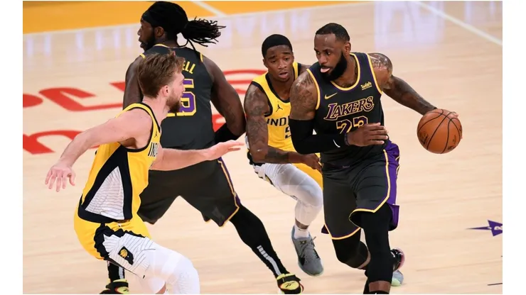 LeBron James and Montrezl Harrell vs. Domantas Sabonis. (Getty)
