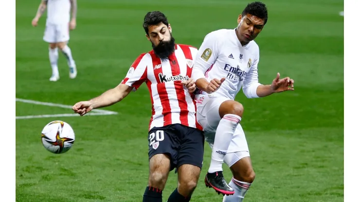 Asier Villalibre of Athletic Bilbao (left) battles for possession with Casemiro of Real Madrid (right). (Getty)