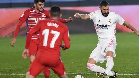 Karim Benzema of Real Madrid (right) scores against Granada. (Getty).jpg