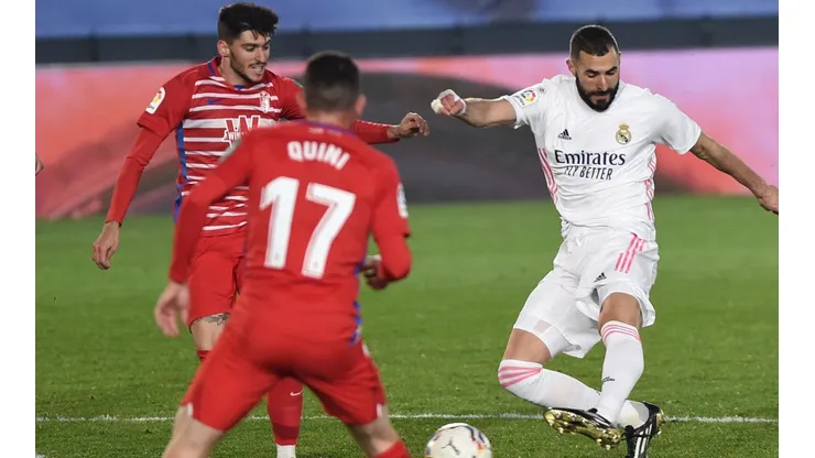 Karim Benzema of Real Madrid (right) scores against Granada. (Getty).jpg