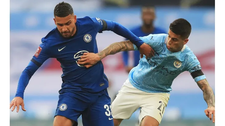 Emerson (left) of Chelsea battles for possession with Joao Cancelo (right) of Manchester City. (Getty)