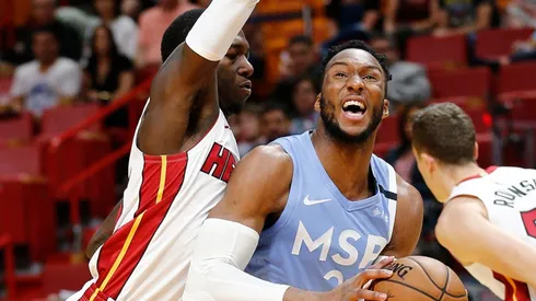 Josh Okogie (right) of the Minnesota Timberwolves drives to the basket against Kendrick Nunn (left) of the Miami Heat. (Getty)