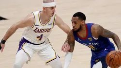 Monte Morris (right) of the Denver Nuggets is guarded by Alex Caruso (left) of the Los Angeles Lakers. (Getty)