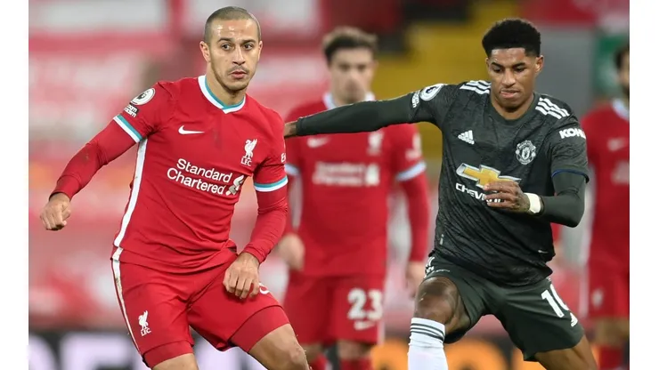 Thiago Alcantara of Liverpool (left) battles for possession with Marcus Rashford of Manchester United (right). (Getty)