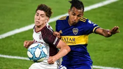 Boca Juniors' Sebastián Villa (right) challenges for the ball with Lanús Tomás Belmonte (Getty).