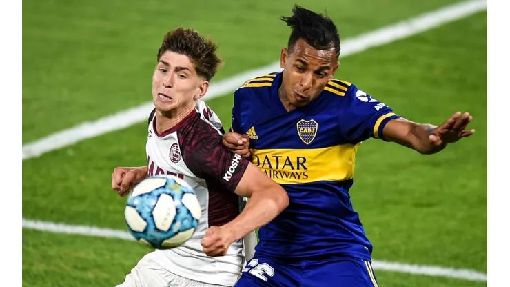 Boca Juniors' Sebastián Villa (right) challenges for the ball with Lanús Tomás Belmonte (Getty).