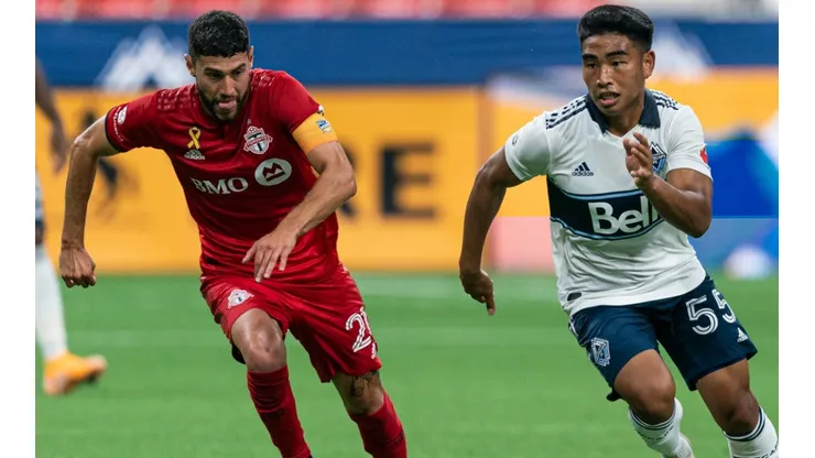 Michael Baldisimo (right) of the Vancouver Whitecaps and Jonathan Osorio (left) of the Toronto FC. (Getty)