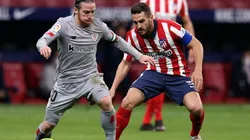 Iker Muniain of Athletic Club (left) is challenged by Koke of Atletico Madrid (right). (Getty)