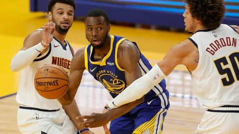 Andrew Wiggins (center) of the Golden State Warriors is guarded by Aaron Gordon (right) and Jamal Murray (left) of the Denver Nuggets. (Getty)